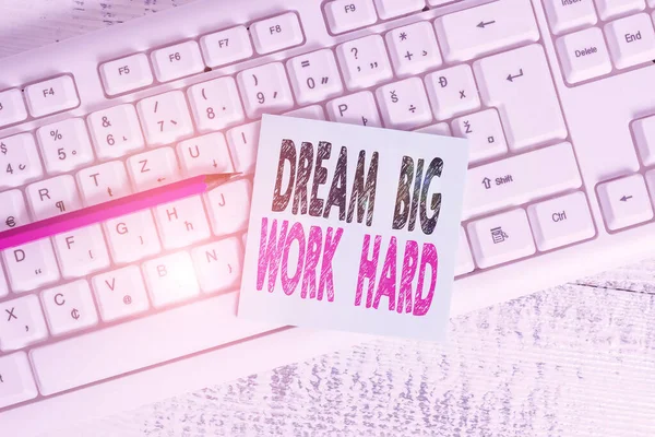 Writing note showing Dream Big Work Hard. Business photo showcasing Believe in yourself and follow the dreams and goals Keyboard office supplies rectangle shape paper reminder wood.