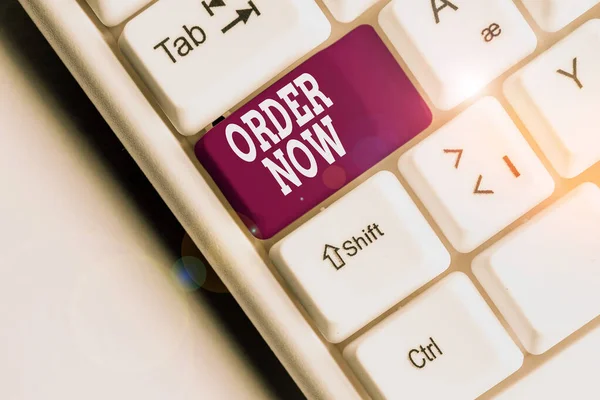 Text sign showing Order Now. Conceptual photo the activity of asking for goods or services from a company White pc keyboard with empty note paper above white background key copy space. — Stock Photo, Image