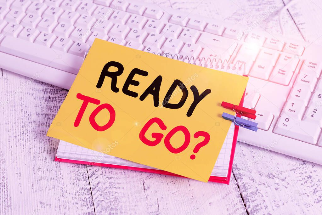 Text sign showing Ready To Go Question. Conceptual photo asking someone if he is prepared or packed his things notebook paper reminder clothespin pinned sheet white keyboard light wooden.