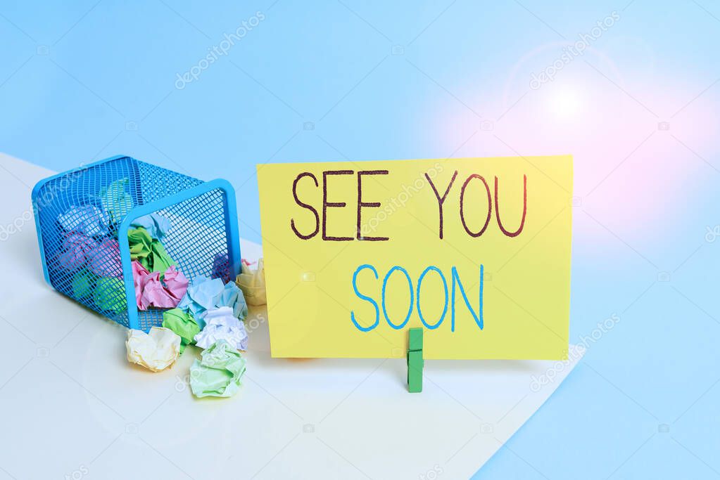 Handwriting text See You Soon. Concept meaning used for saying goodbye to someone and going to meet again soon Trash bin crumpled paper clothespin empty reminder office supplies tipped.