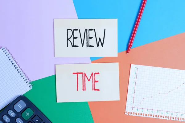 Text sign showing Review Time. Conceptual photo to think or talk about something again Set schedule to review Office appliance colorful square desk study supplies empty paper sticker. — ストック写真