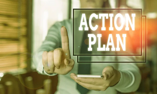 Conceptual hand writing showing Action Plan. Business photo text detailed plan outlining actions needed to reach goals or vision Woman in the background pointing with finger in empty space.