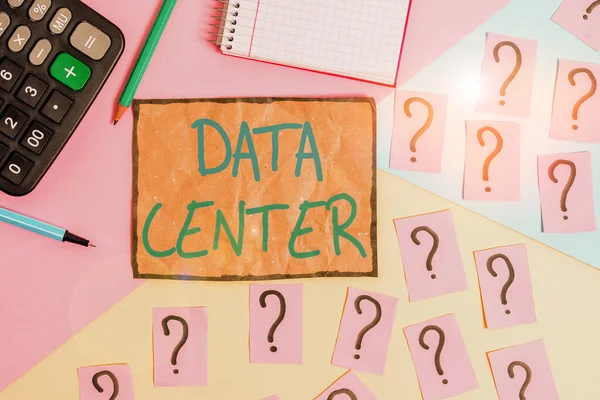 Writing note showing Data Center. Business photo showcasing a repository that houses computing facilities like servers Mathematics stuff and writing equipment above pastel colours background.