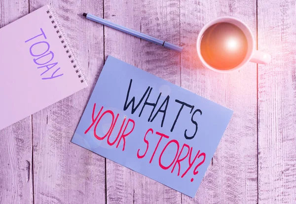 Writing note showing What S Is Your Storyquestion. Business photo showcasing analysisner of asking demonstrating about past life events Stationary placed next to a cup of black coffee above the wooden — Stockfoto