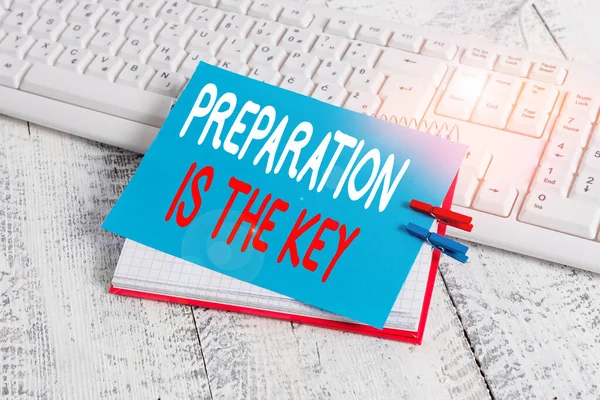 Writing note showing Preparation Is The Key. Business photo showcasing it reduces errors and shortens the activities notebook reminder clothespin with pinned sheet light wooden.