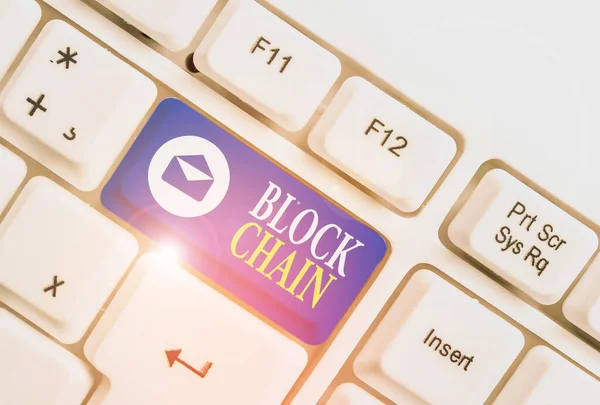 Word writing text Block Chain. Business concept for system in which a record of transactions made in bitcoin White pc keyboard with empty note paper above white background key copy space. — Stock Photo, Image