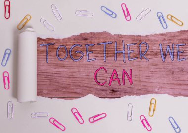 Writing note showing Together We Can. Business photo showcasing unity can makes everything possible One powerful group Paper clip and torn cardboard on wood classic table backdrop. clipart