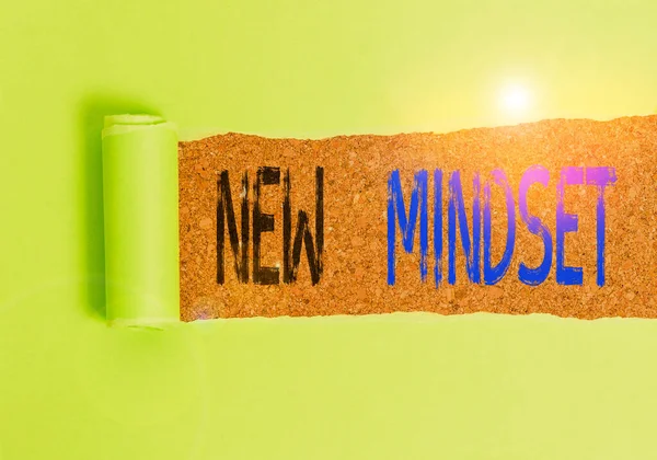 Text sign showing New Mindset. Conceptual photo Mental attitude or disposition New approach in dealing situation Cardboard which is torn in the middle placed above a wooden classic table. — Stock Photo, Image