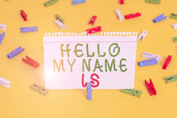 Handwriting text Hello My Name Is. Concept meaning introducing yourself to new showing workers as Presentation Colored clothespin papers empty reminder yellow floor background office.