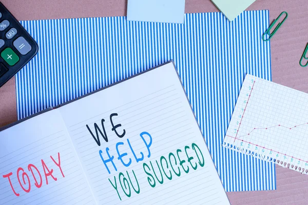 Handwriting text writing We Help You Succeed. Concept meaning Aided Supported Funded someone to reach his dreams Striped paperboard notebook cardboard office study supplies chart paper.