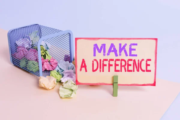 Writing note showing Make A Difference. Business photo showcasing Mark an effect on a demonstrating or situation Cause a change Trash bin crumpled paper clothespin reminder office supplies.