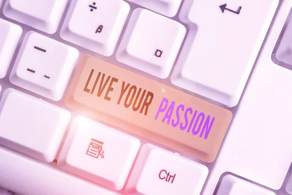 Text sign showing Live Your Passion. Conceptual photo Doing something you love that you do not consider a job White pc keyboard with empty note paper above white background key copy space. — ストック写真