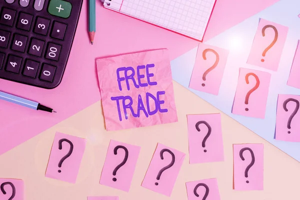 Handwriting text Free Trade. Concept meaning international trade left to its natural course without tariffs Mathematics stuff and writing equipment above pastel colours background.