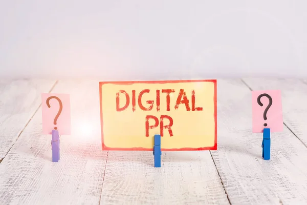 Text sign showing Digital Pr. Conceptual photo marketing strategy used to increase their online presence Scribbled and crumbling sheet with paper clips placed on the wooden table.