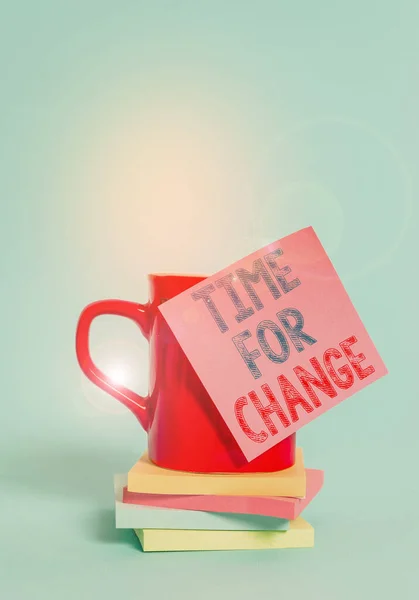 Conceptual hand writing showing Time For Change. Business photo showcasing Changing Moment Evolution New Beginnings Chance to Grow Coffee cup colored sticky note stacked pads plain background. — Stock Photo, Image