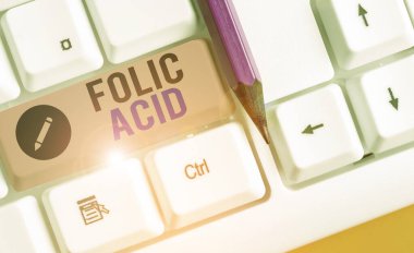 Writing note showing Folic Acid. Business photo showcasing a vitamin of the B complex found in leafy green vegetables.