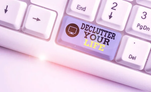 Handwriting text writing Declutter Your Life. Concept meaning To eliminate extraneous things or information in life White pc keyboard with empty note paper above white background key copy space. — Stock Photo, Image