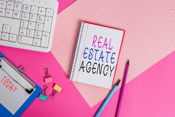 Conceptual hand writing showing Real Estate Agency. Business photo showcasing Business Entity Arrange Sell Rent Lease Manage Properties Writing equipments and computer stuff placed on plain table. — 스톡 사진