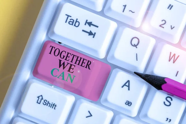 Conceptual hand writing showing Together We Can. Business photo showcasing unity can makes everything possible One powerful group White pc keyboard with note paper above the white background. — Stok fotoğraf