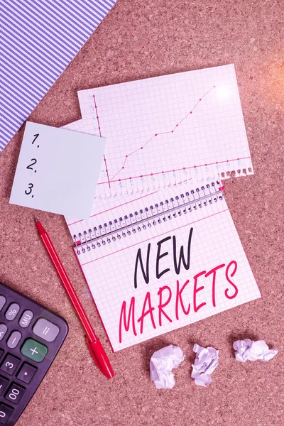 Conceptual hand writing showing New Markets. Business photo text market where the end product or service is new or not exist yet Desk notebook paper office paperboard study supplies chart. — 스톡 사진
