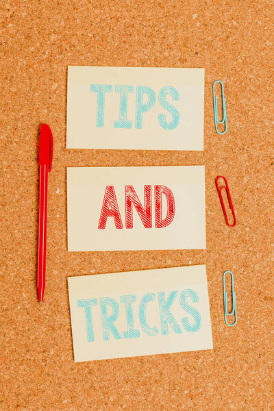Writing note showing Tips And Tricks. Business photo showcasing helpful advices that makes certain action easier to do Empty sticker reminder memo billboard corkboard desk paper.