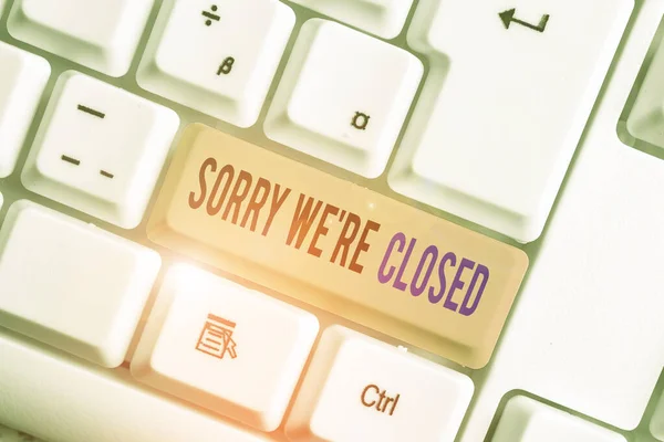 Text sign showing Sorry We Re Closed. Conceptual photo Expression of Regret Disappointment Not Open Sign White pc keyboard with empty note paper above white background key copy space. — Stock Photo, Image