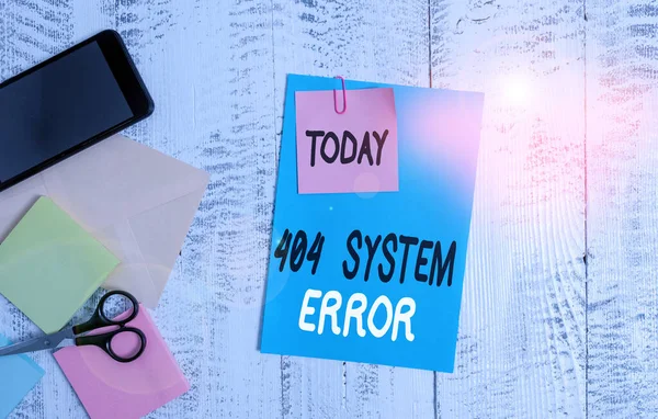 Writing note showing 404 System Error. Business photo showcasing message appears when website is down and cant be reached Envelope paper sheet smartphone notepads scissors wooden background. — 图库照片