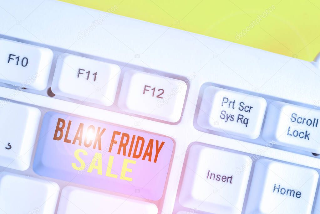 Conceptual hand writing showing Black Friday Sale. Business photo showcasing Shopping Day Start of the Christmas Shopping Season White pc keyboard with note paper above the white background.