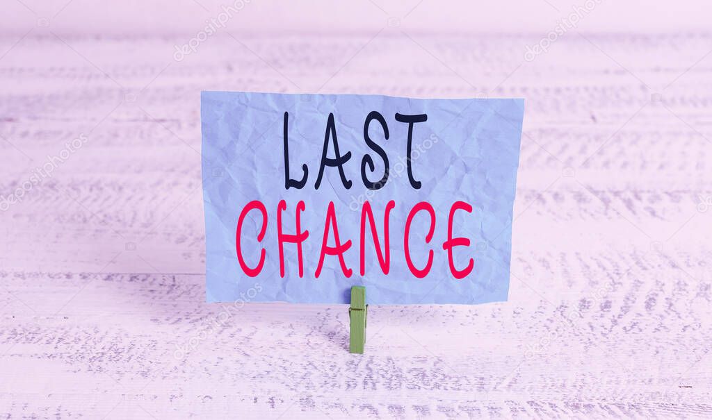 Word writing text Last Chance. Business concept for a situation considered to be the last opportunity for success Green clothespin white wood background colored paper reminder office supply.