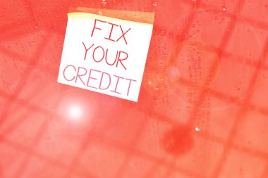 Writing note showing Fix Your Credit. Business photo showcasing Keep balances low on credit cards and other credit Square paper piece notation stick to textured glass window. clipart