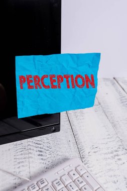 Handwriting text Perception. Concept meaning individuals organize and interpret their sensory impressions Notation paper taped to black computer monitor screen near white keyboard.