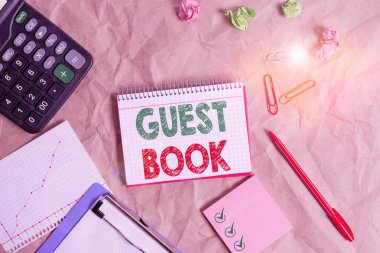 Word writing text Guest Book. Business concept for electronic means for a visitor to acknowledge a visit to a site Papercraft craft paper desk square spiral notebook office study supplies.