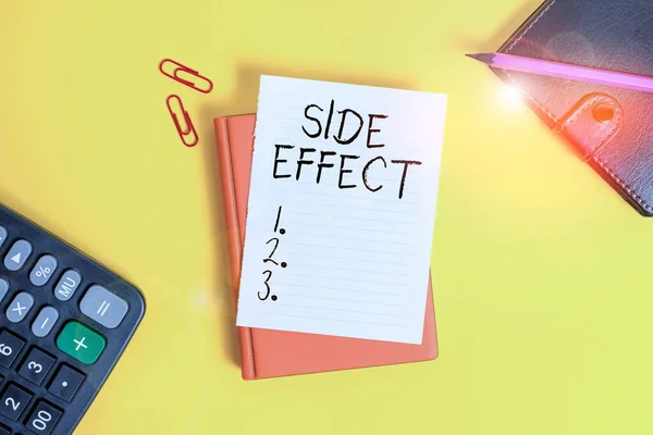 Text sign showing Side Effect. Conceptual photo typically undesirable effect of a drug or medical treatment Pile of empty papers with copy space on the table.