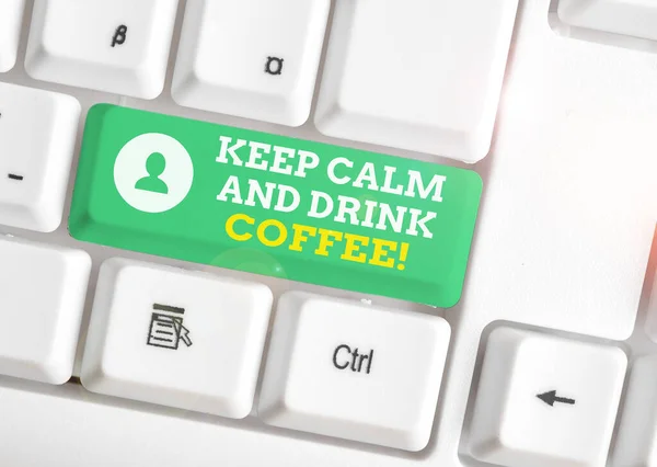 Conceptual hand writing showing Keep Calm And Drink Coffee. Business photo text encourage demonstrating to enjoy caffeine drink and relax White pc keyboard with note paper above the white background. — Stock Photo, Image