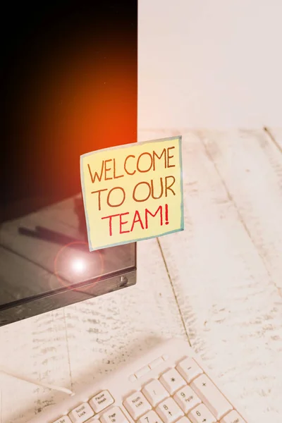 Handwriting text Welcome To Our Team. Concept meaning introducing another demonstrating to your team mates Notation paper taped to black computer monitor screen near white keyboard. — Stock Photo, Image