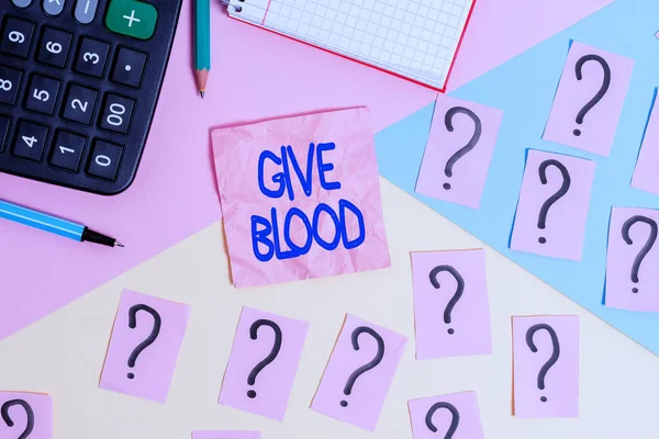 Handwriting text Give Blood. Concept meaning demonstrating voluntarily has blood drawn and used for transfusions Mathematics stuff and writing equipment above pastel colours background. — Stock Photo, Image