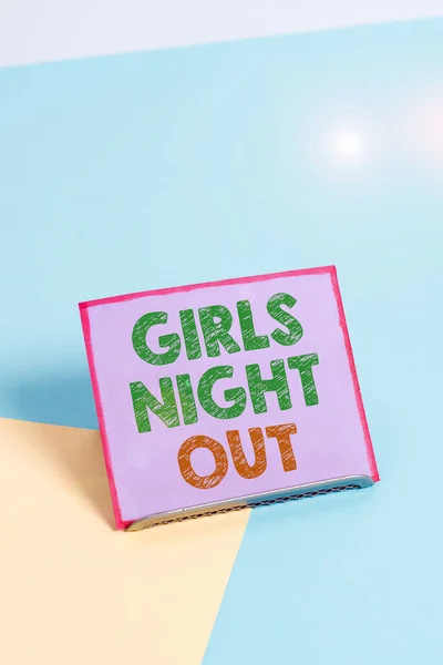 Word writing text Girls Night Out. Business concept for Freedoms and free mentality to the girls in modern era Paper placed tilted above buffer wire on soft pastel multi colours backdrop. — Stok fotoğraf