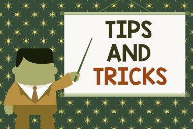 Handwriting text Tips And Tricks. Concept meaning piece of inside facts specially in betting or investing Businessman standing in front projector screen pointing project idea.