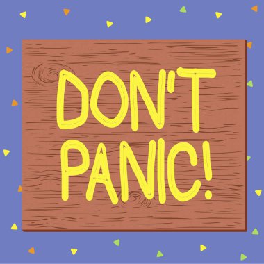 Don T Panik 'i gösteren bir mesaj. Kavramsal fotoğraf birden o kadar endişeli ya da korkmuş hissetmeye başlarsınız ki gerçek dışı çizgi film ahşap çivilenmiş, renkli duvara çivilenmiş dikdörtgen gibi davranamazsınız..