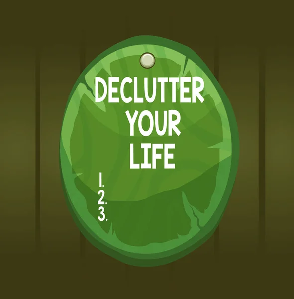 Psaný vzkaz ukazující Declutter Your Life. Podniková fotografie showcasing Chcete-li odstranit cizí věci nebo informace v životě Oválná deska kulaté dřevěné desky kruh ve tvaru dřeva pozadí. — Stock fotografie