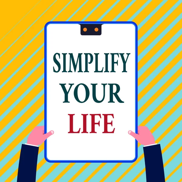 Writing note showing Simplify Your Life. Business photo showcasing Manage your day work Take the easy way Organize White rectangle clipboard with blue frame has two holes holds by hands. — 图库照片