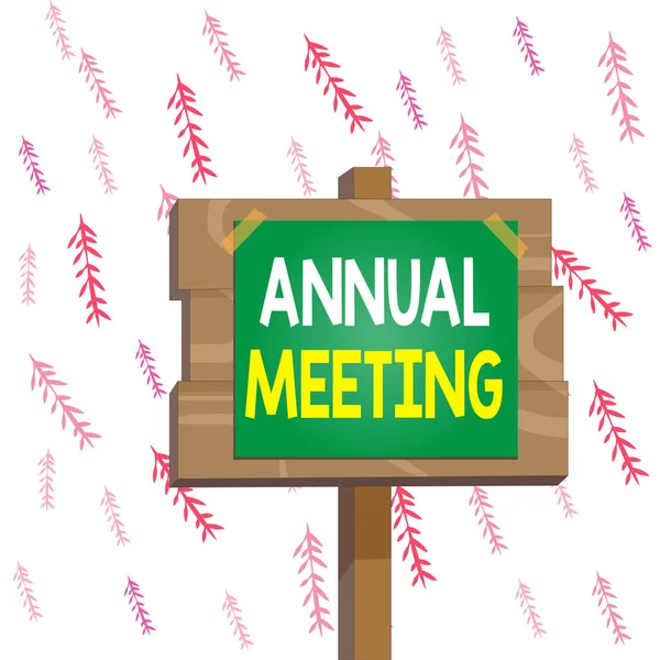Handwriting text writing Annual Meeting. Concept meaning yearly meeting of the general membership of an organization Wood plank wooden stick pole paper note attached adhesive tape empty space.