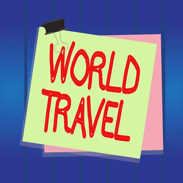 Writing note showing World Travel. Business photo showcasing the movement of showing between distant geographical locations Paper stuck binder clip colorful background reminder memo office supply. — Stock Photo, Image