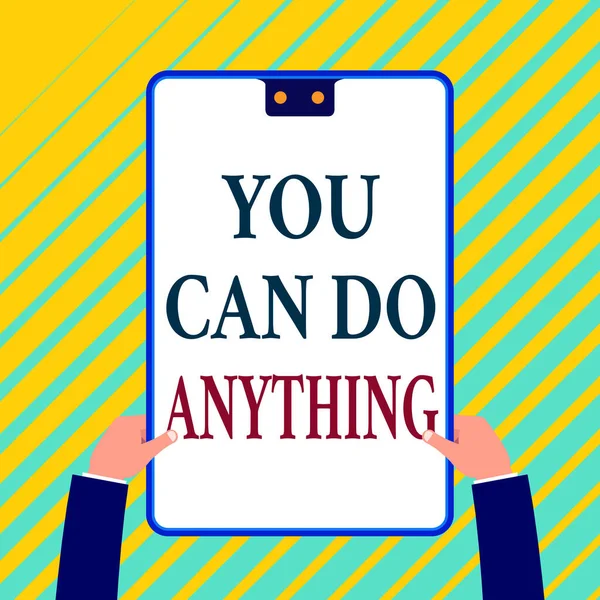 Writing note showing You Can Do Anything. Business photo showcasing Motivation for doing something Believe in yourself White rectangle clipboard with blue frame has two holes holds by hands. — Stock Photo, Image