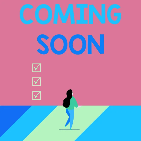 Word writing text Coming Soon. Business concept for something is going to happen soon or after a short time Back view young long hair woman holding big blank square announcement. — Stock Photo, Image
