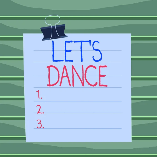 Conceptual hand writing showing Let S Is Dance. Business photo showcasing move rhythmically to music following a set sequence of steps Paper lines binder clip suare notebook color background.
