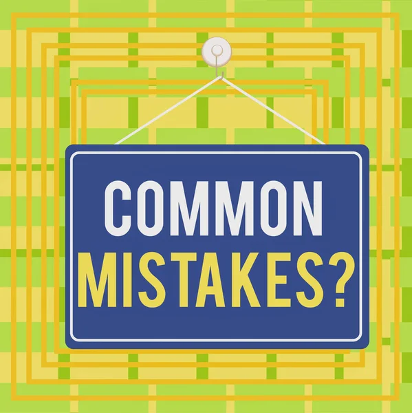 Text sign showing Common Mistakes question. Conceptual photo repeat act or judgement misguided or wrong Colored memo reminder empty board blank space attach background rectangle. — Stock Photo, Image
