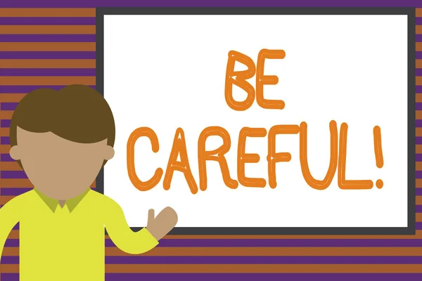 Text sign showing Be Careful. Conceptual photo making sure of avoiding potential danger mishap or harm Young man standing in front whiteboard pointing to project. photo Art. — Stock Photo, Image