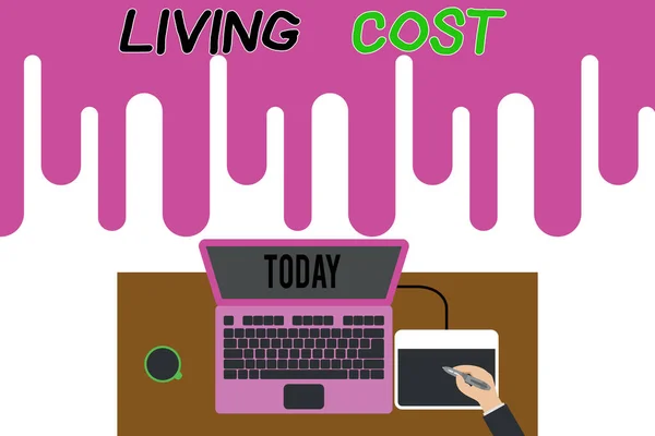 Handwriting text writing Living Cost. Concept meaning the amount of money that a demonstrating needs to sustain life Upper view laptop wooden desk worker drawing tablet coffee cup office. — Stok fotoğraf