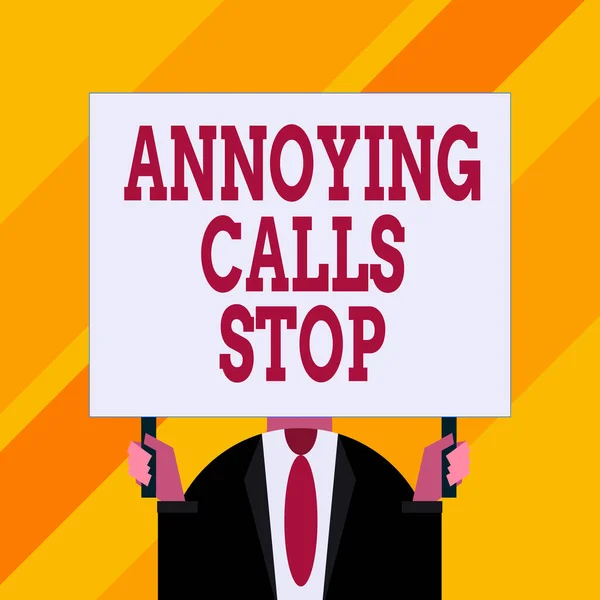Conceptual hand writing showing Annoying Calls Stop. Business photo showcasing Prevent spam phones Blacklisting numbers Angry caller Just man chest dressed dark suit tie holding big rectangle.